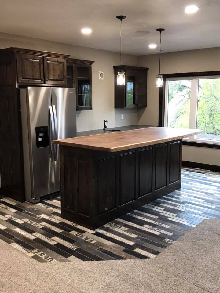 Stained dark espresso kitchen cabinets and island with butcher-block top, RPS Painting, Sioux Falls SD.
